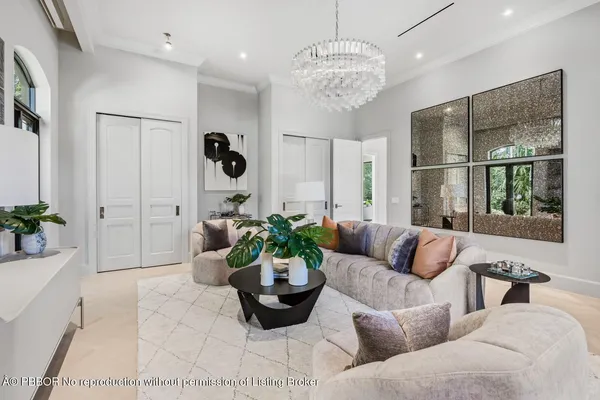 a kitchen with stainless steel appliances kitchen island granite countertop a refrigerator a stove a sink dishwasher and white cabinets with wooden floor