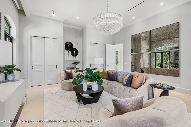 a kitchen with stainless steel appliances kitchen island granite countertop a refrigerator a stove a sink dishwasher and white cabinets with wooden floor