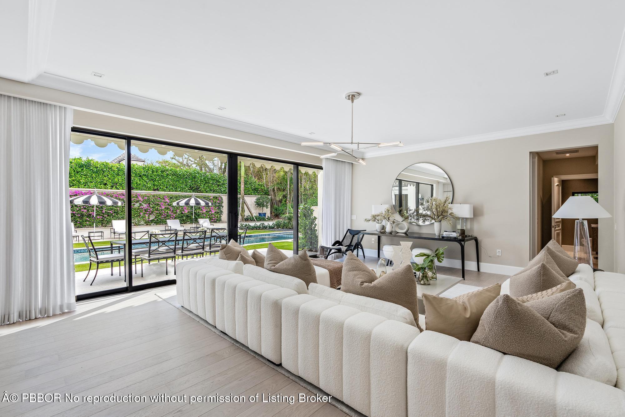 150 El Vedado Road Palm Beach, FL 33480 - Photo 15 of 77 a living room with furniture and a table with wooden floor
