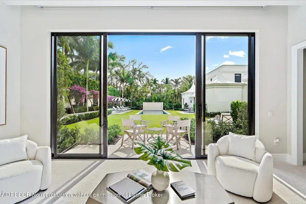 a view of a room with furniture and windows