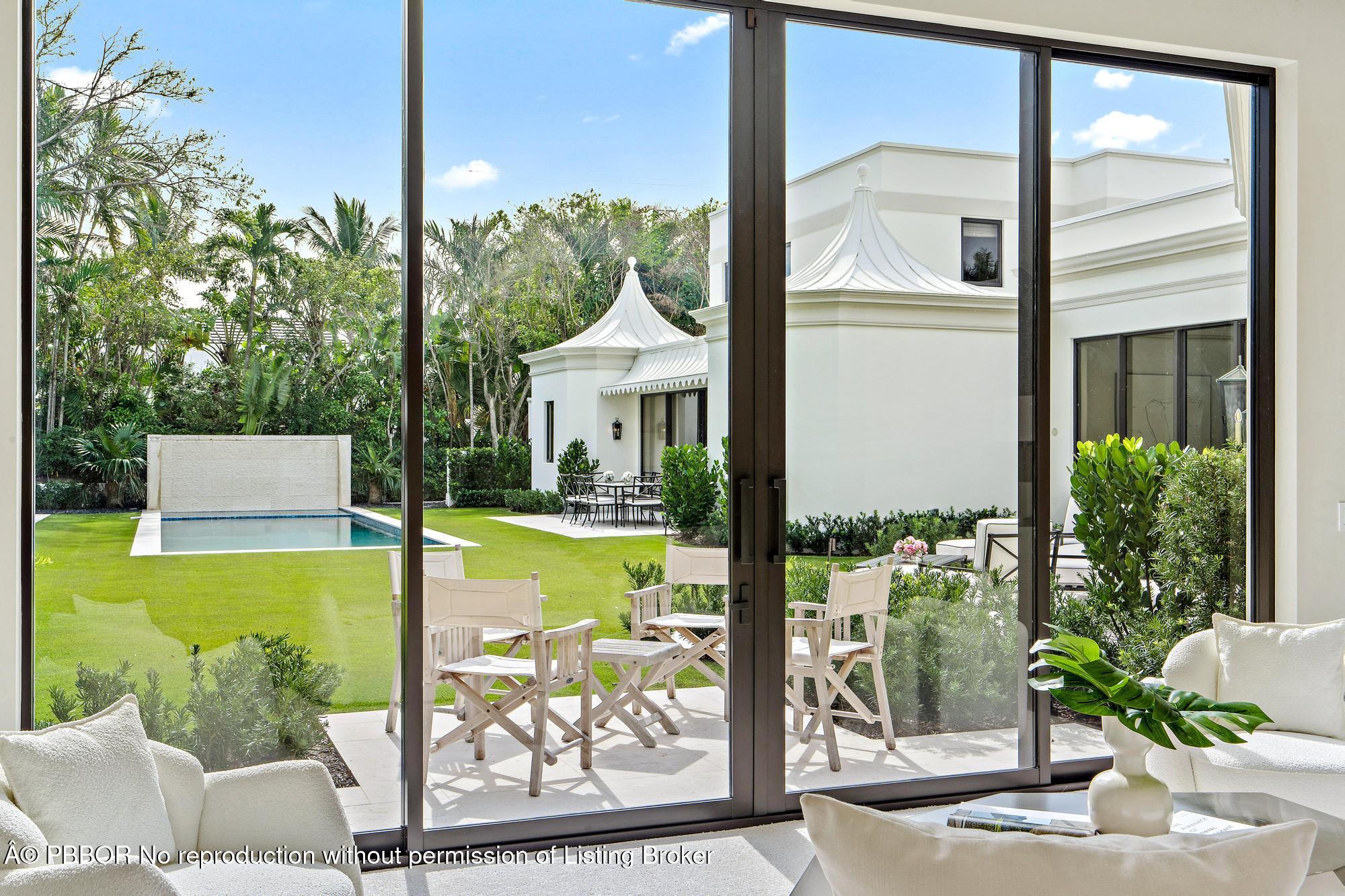 150 El Vedado Road Palm Beach, FL 33480 - Photo 26 of 77 a view of a swimming pool with a patio