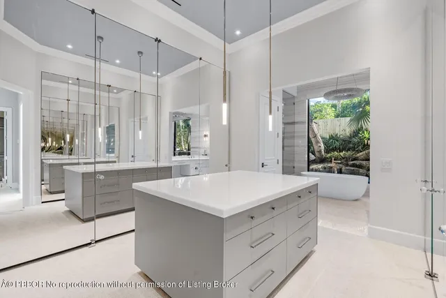 a bathroom with a toilet a sink a tub and a mirror