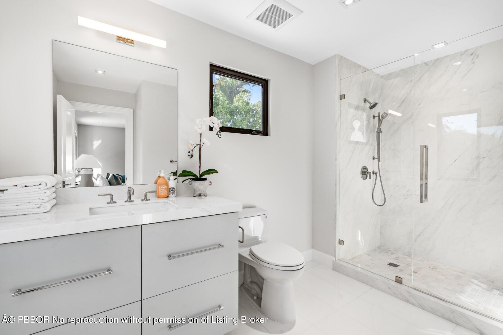 150 El Vedado Road Palm Beach, FL 33480 - Photo 42 of 77 a bathroom with a shower sink vanity mirror and toilet