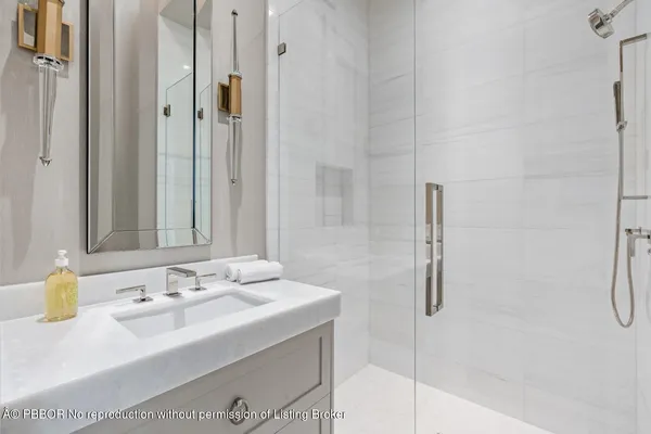 a view of a house with a yard and potted plants