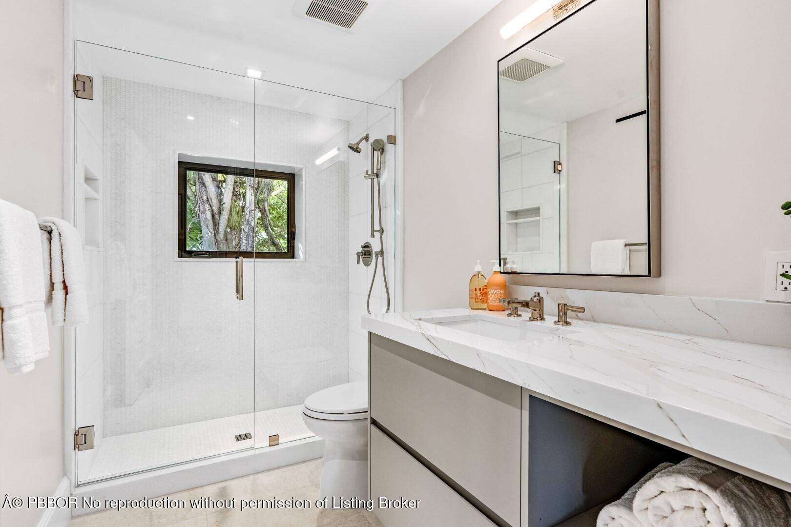 150 El Vedado Road Palm Beach, FL 33480 - Photo 46 of 77 a bathroom with a sink a toilet and shower