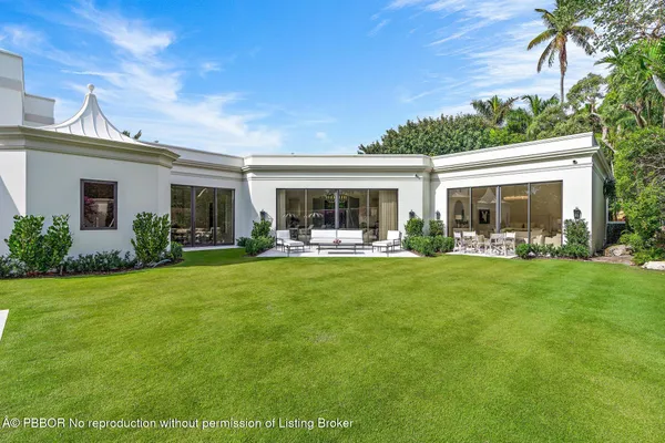 a view of swimming pool with a yard and sitting area