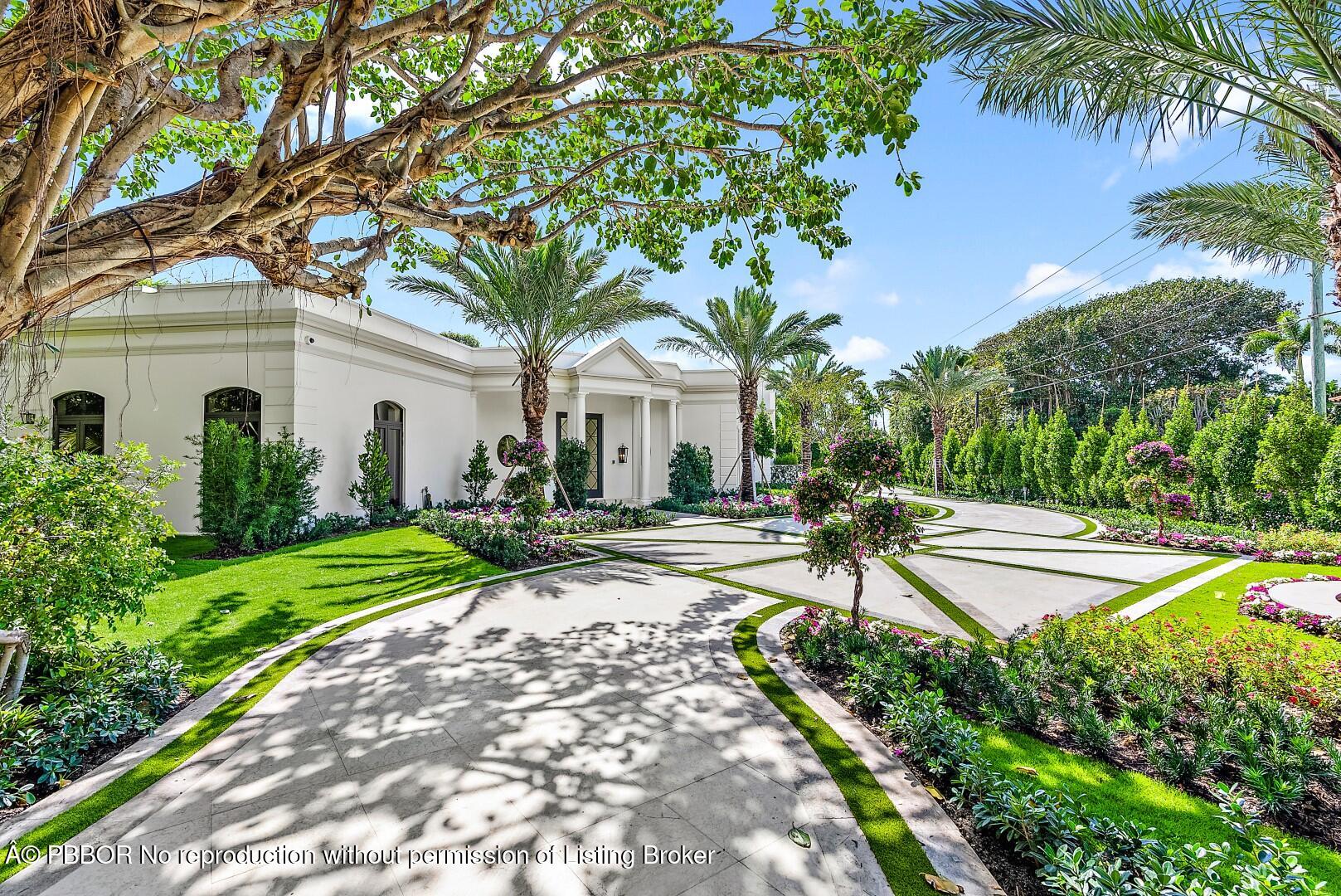 150 El Vedado Road Palm Beach, FL 33480 - Photo 57 of 77 a view of a house with a yard and palm trees