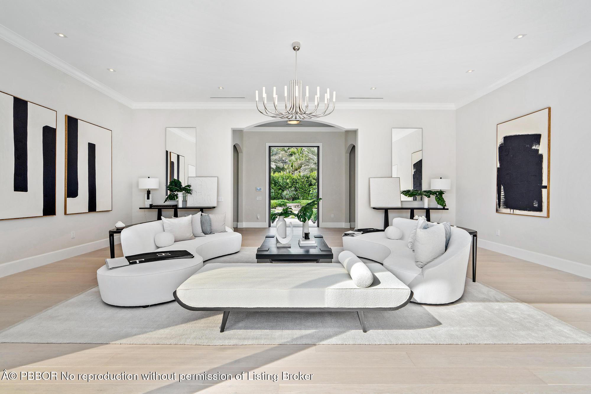 150 El Vedado Road Palm Beach, FL 33480 - Photo 7 of 77 a living room with furniture a chandelier and a window