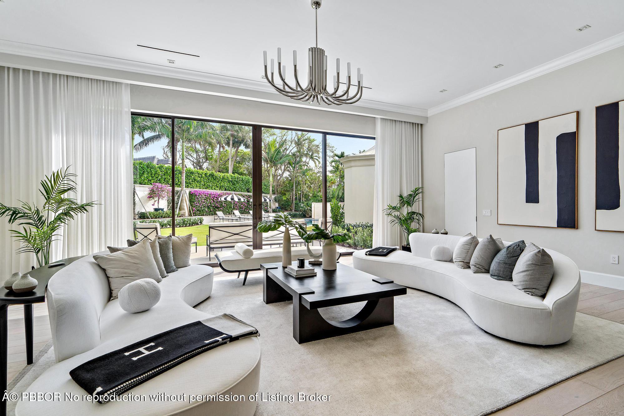 150 El Vedado Road Palm Beach, FL 33480 - Photo 9 of 77 a living room with furniture and floor to ceiling windows