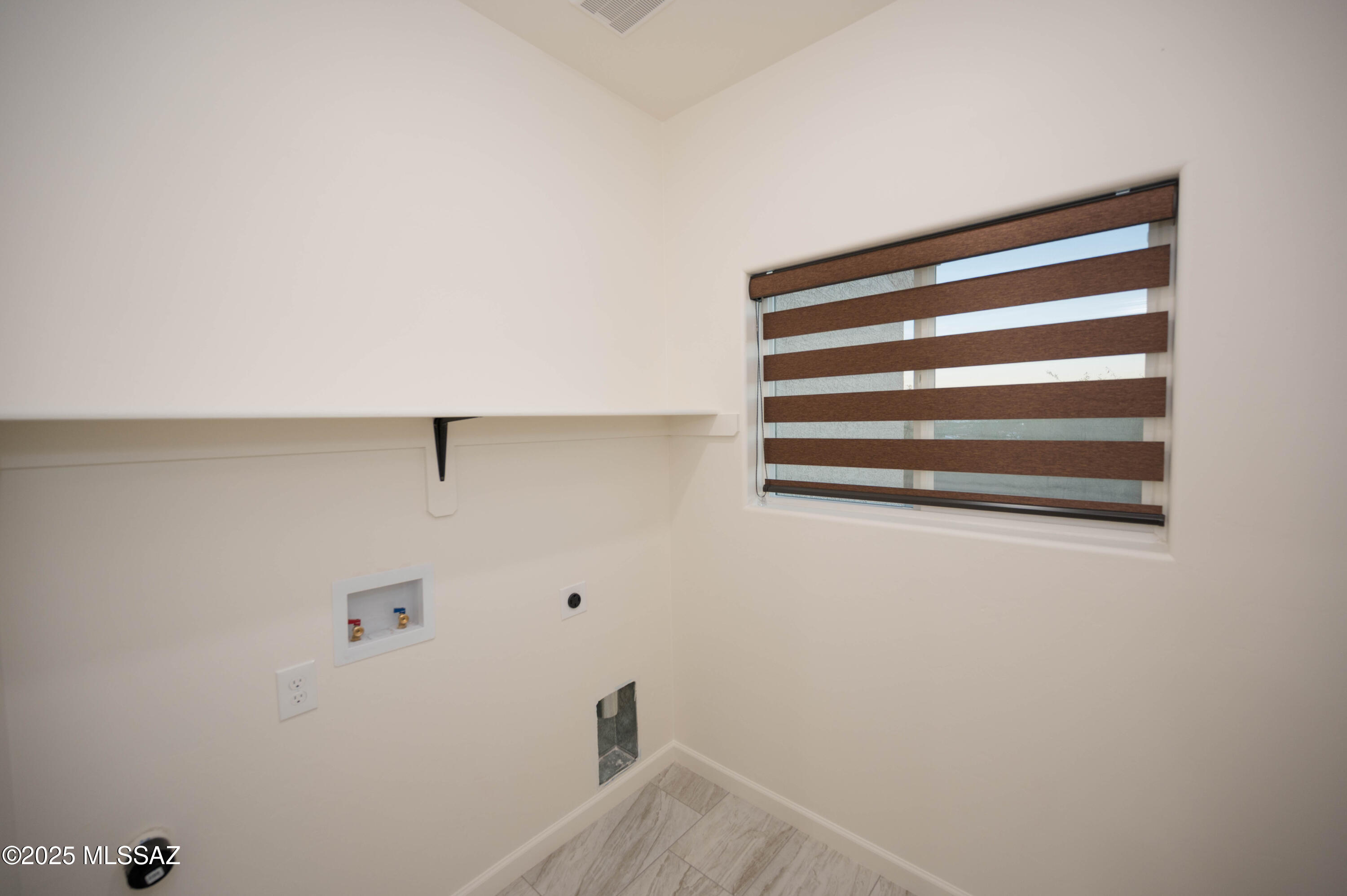 497 Calle Cipres Rio Rico, AZ 85648 - Photo 40 of 50 a view of a room with racks on the wall