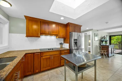 a kitchen with a sink cabinets and stainless steel appliances