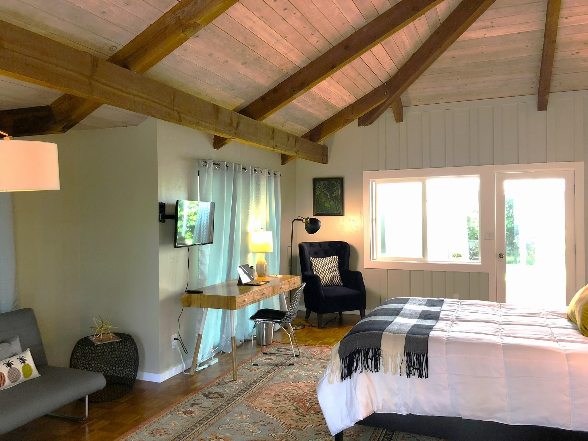 620 Awalau Road Haiku, HI 96708 - Photo 14 of 50 a living room with furniture and a large window