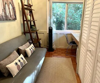 a living room with furniture and a window