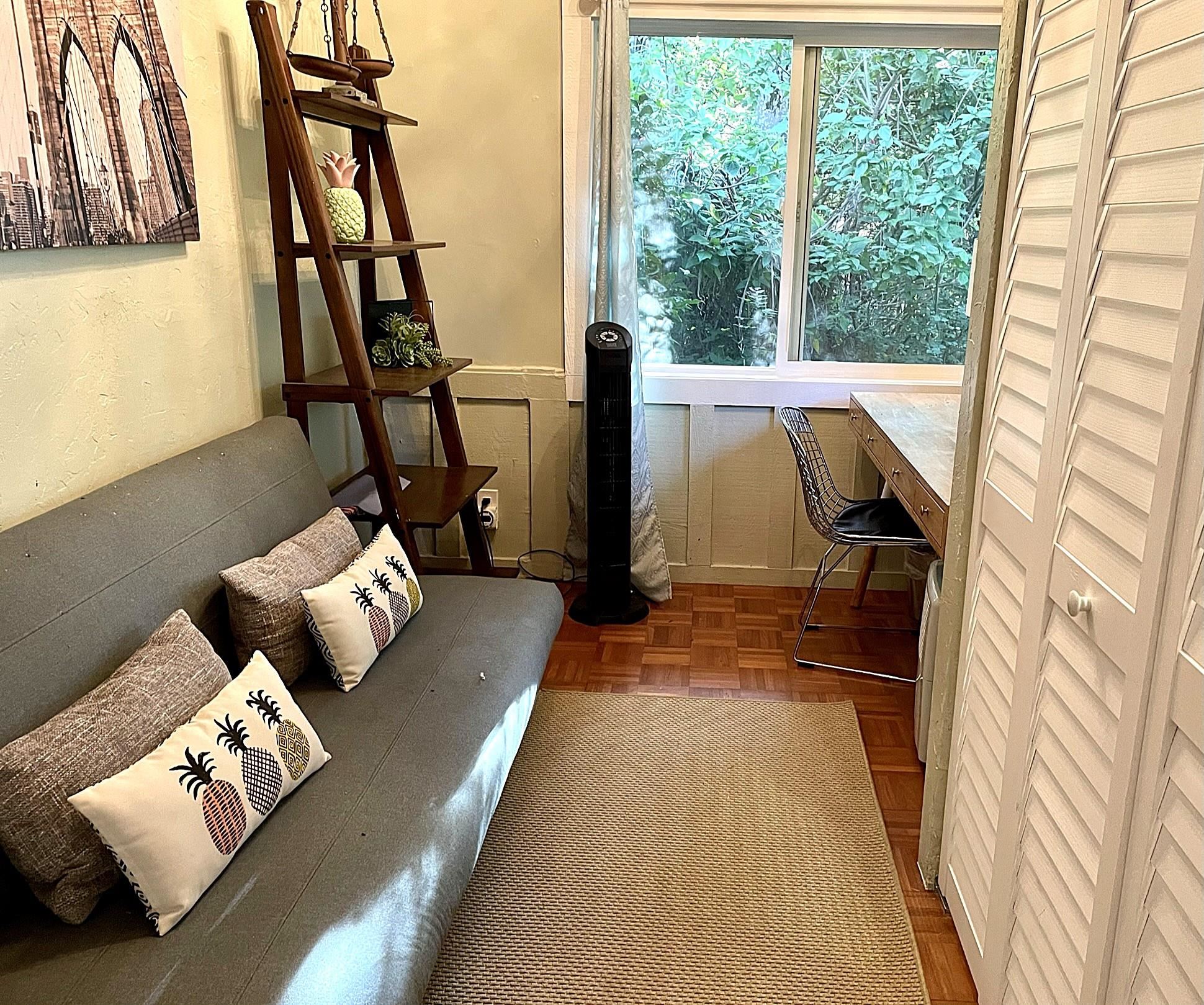 620 Awalau Road Haiku, HI 96708 - Photo 18 of 50 a living room with furniture and a window