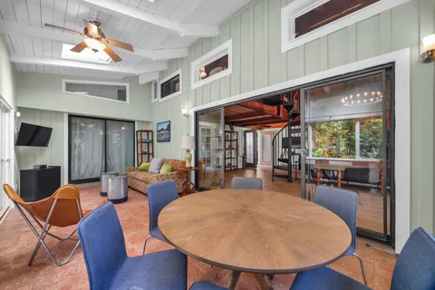 a view of a dining room with furniture window and outside view