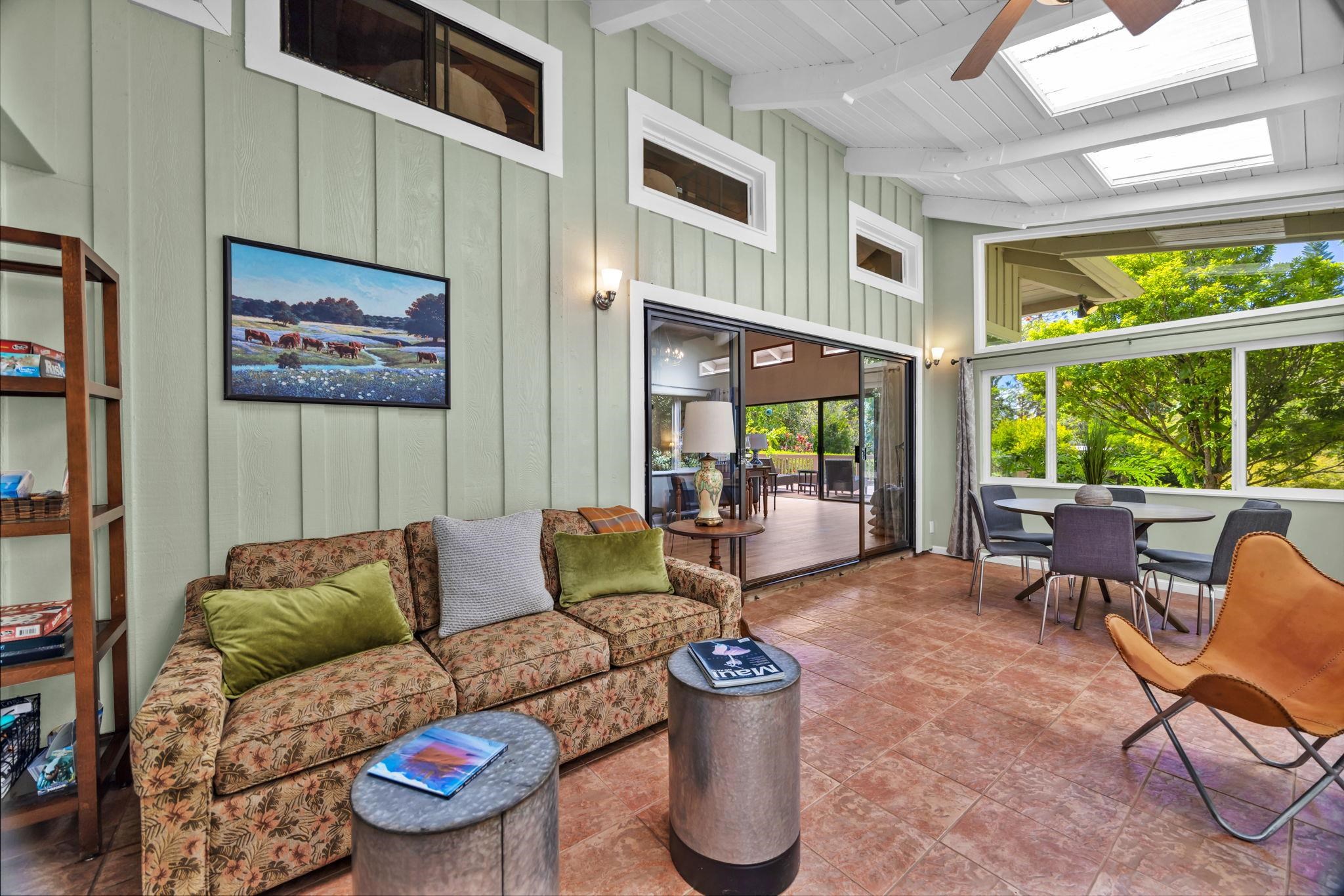 620 Awalau Road Haiku, HI 96708 - Photo 25 of 50 a living room with furniture and a large window