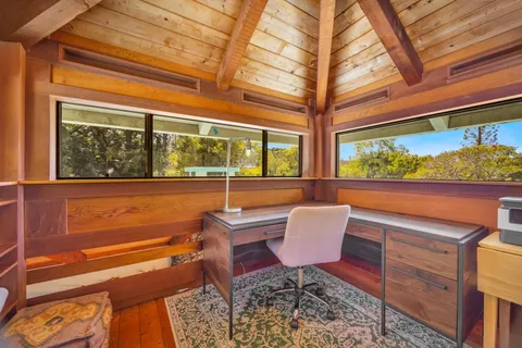 a view of a chairs and table in the balcony