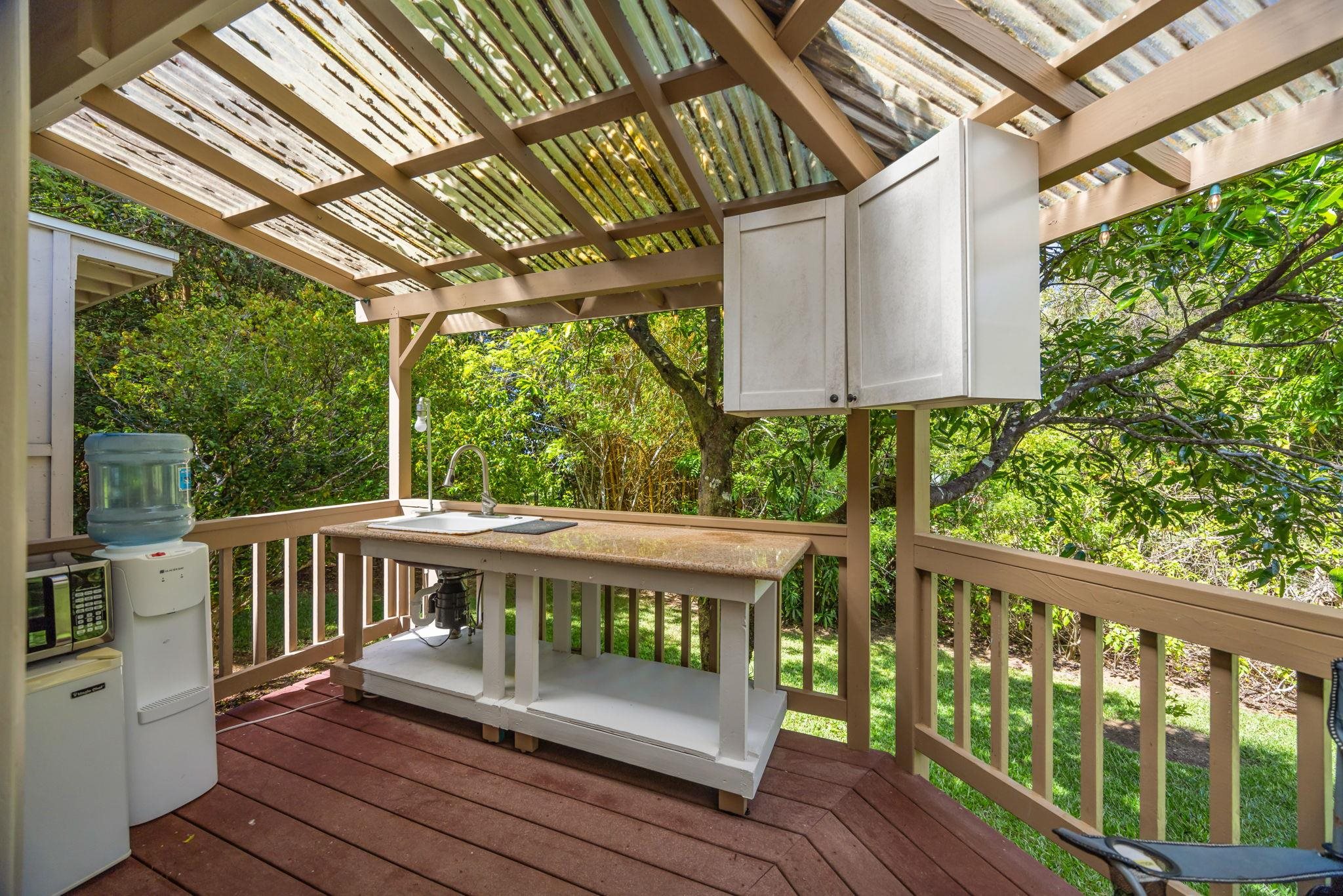 620 Awalau Road Haiku, HI 96708 - Photo 41 of 50 a view of a wooden chairs on the deck
