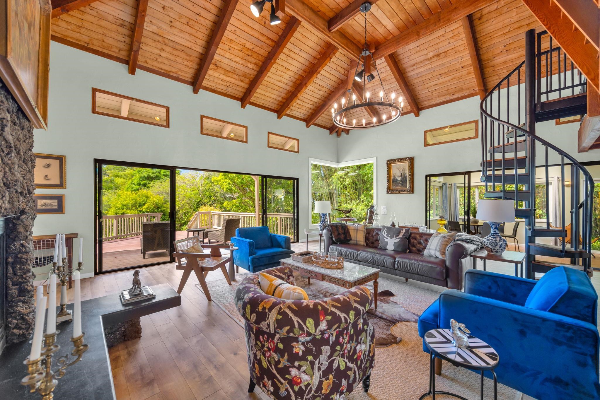 620 Awalau Road Haiku, HI 96708 - Photo 5 of 50 a living room with furniture large windows and wooden floor