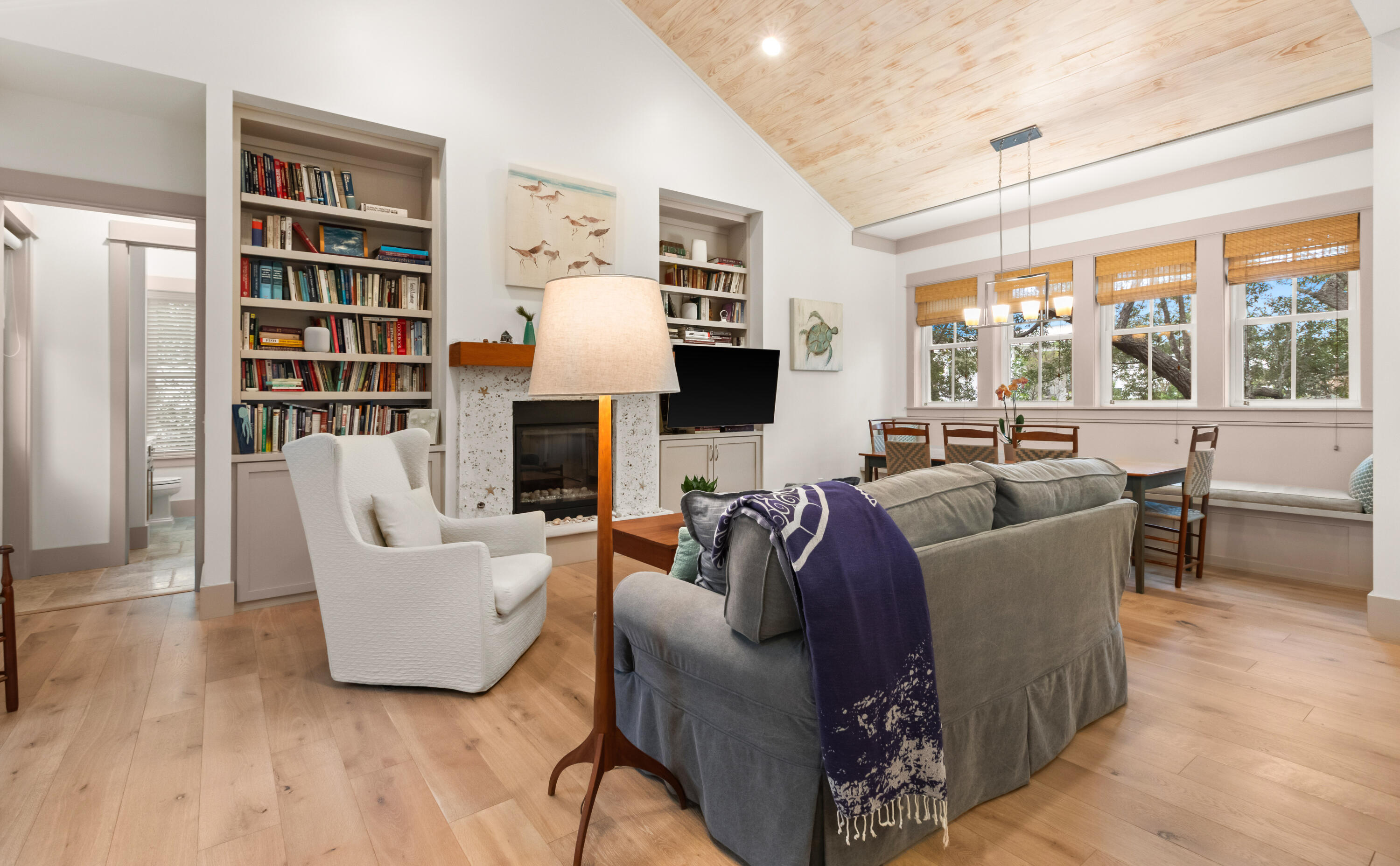 321 Seabreeze Boulevard Seacrest, FL 32461 - Photo 14 of 51 a living room with fireplace furniture and a large window