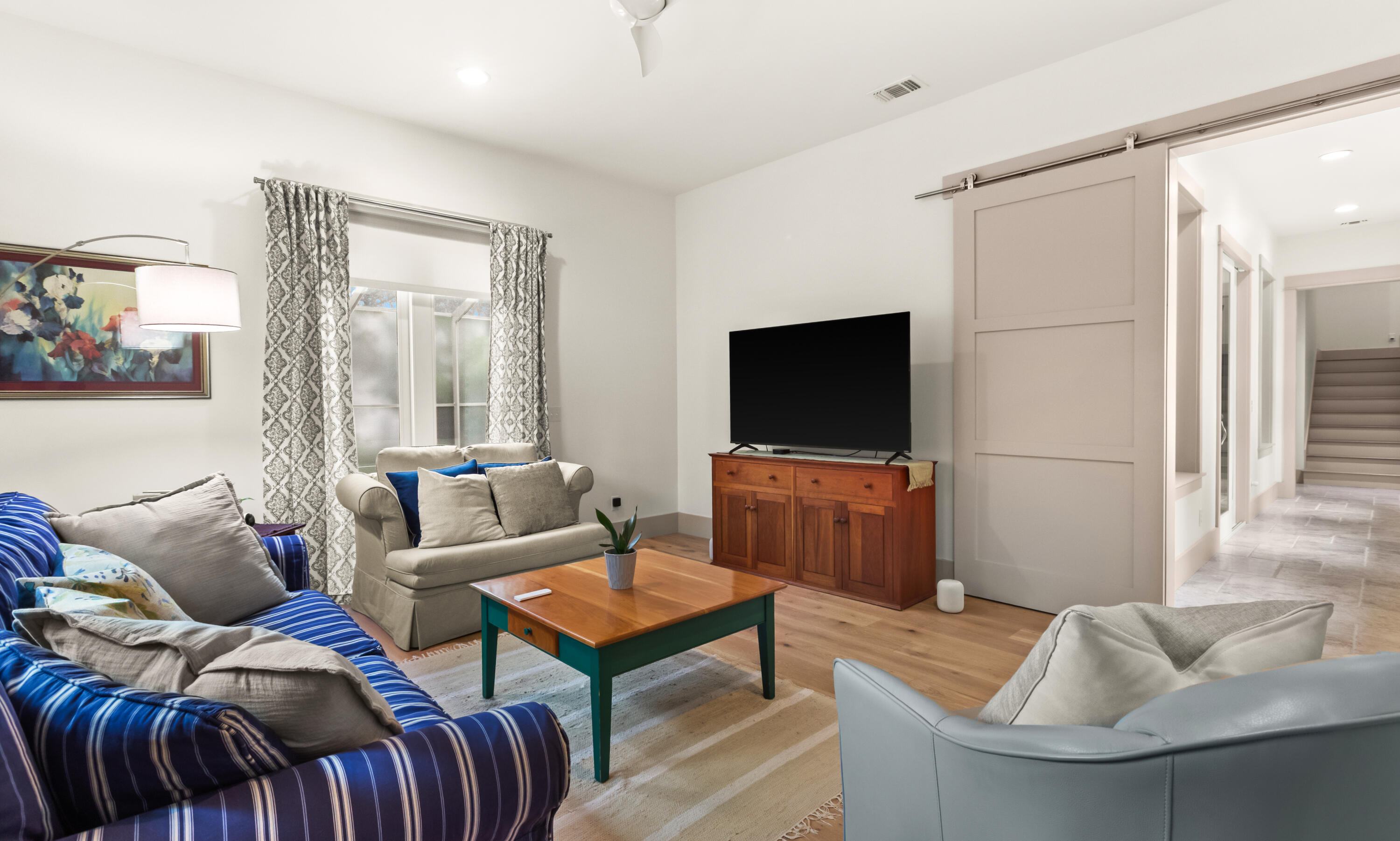 321 Seabreeze Boulevard Seacrest, FL 32461 - Photo 23 of 51 a living room with furniture and a flat screen tv