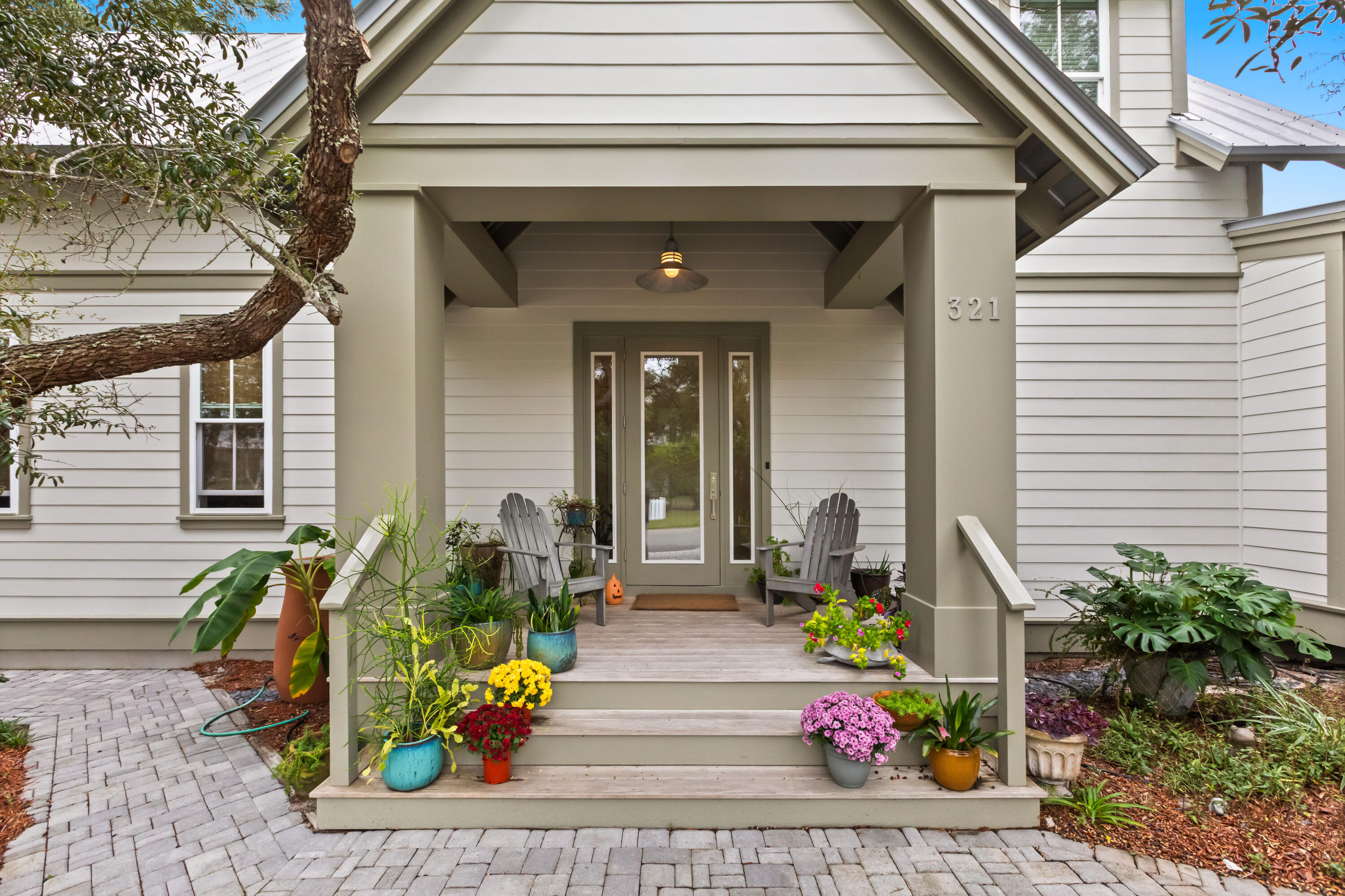 321 Seabreeze Boulevard Seacrest, FL 32461 - Photo 3 of 51 a front view of a house with outdoor seating
