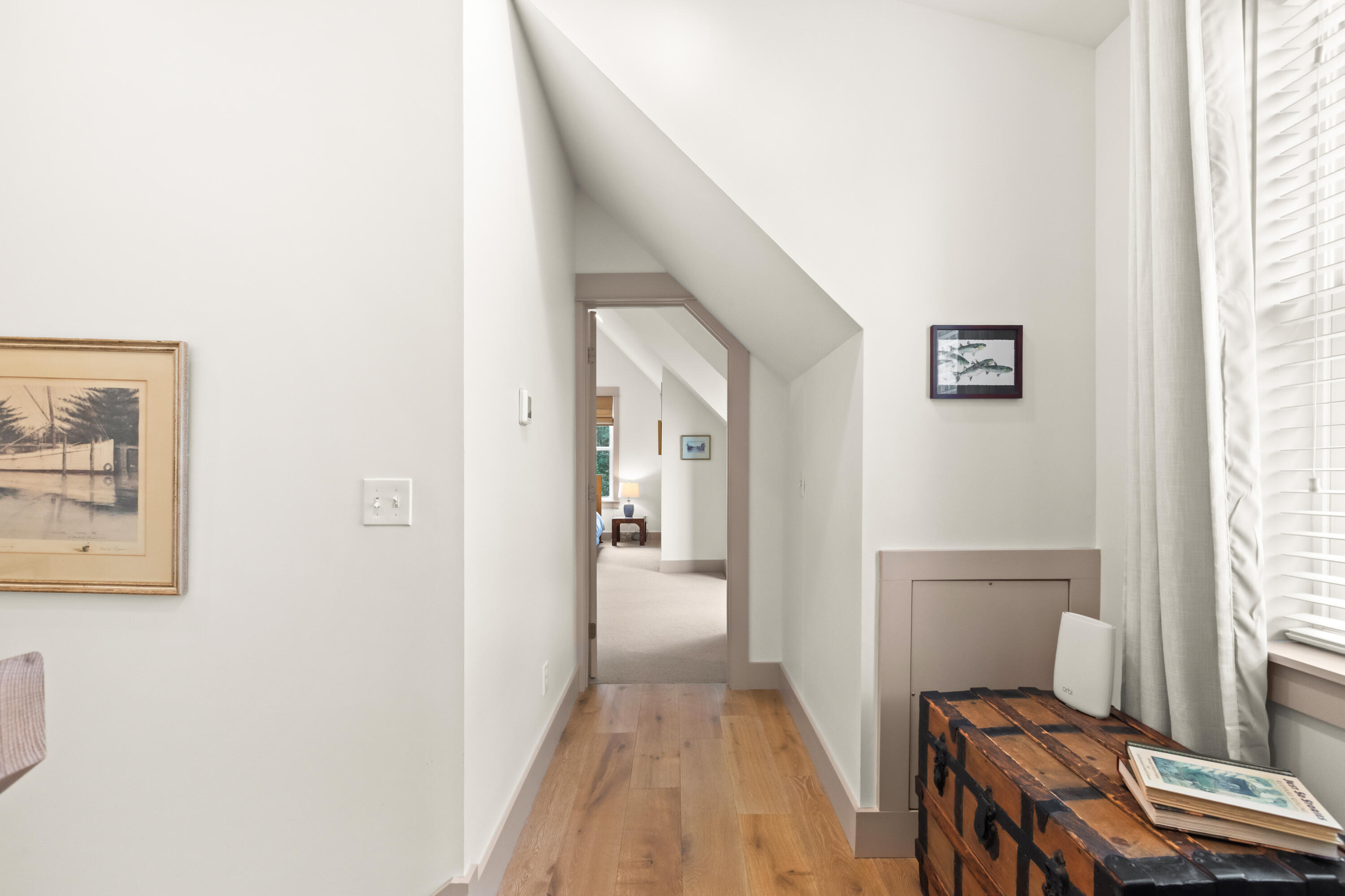 321 Seabreeze Boulevard Seacrest, FL 32461 - Photo 37 of 51 a view of a hallway with wooden floor and a livingroom
