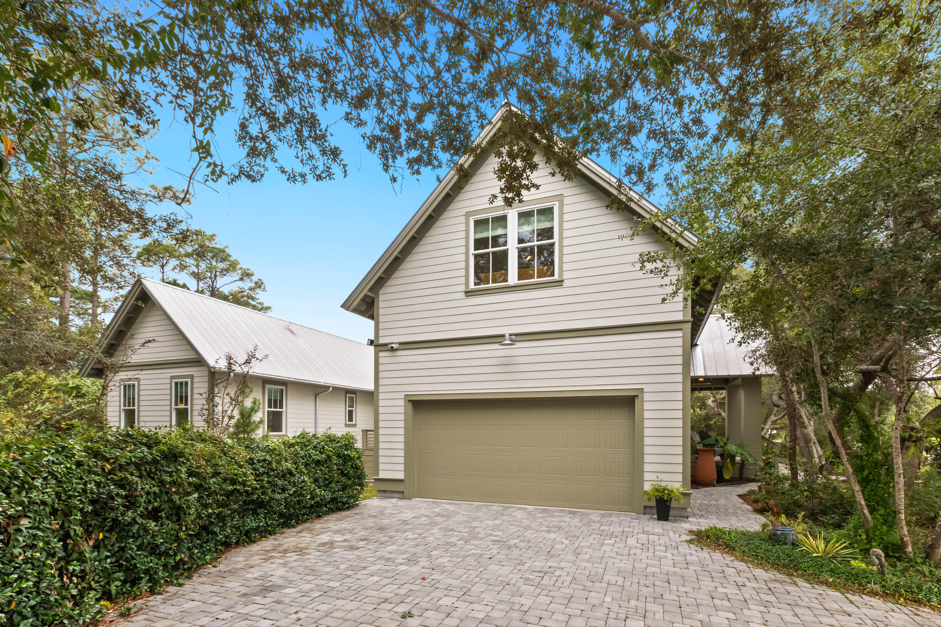 321 Seabreeze Boulevard Seacrest, FL 32461 - Photo 4 of 51 a front view of a house with a garden