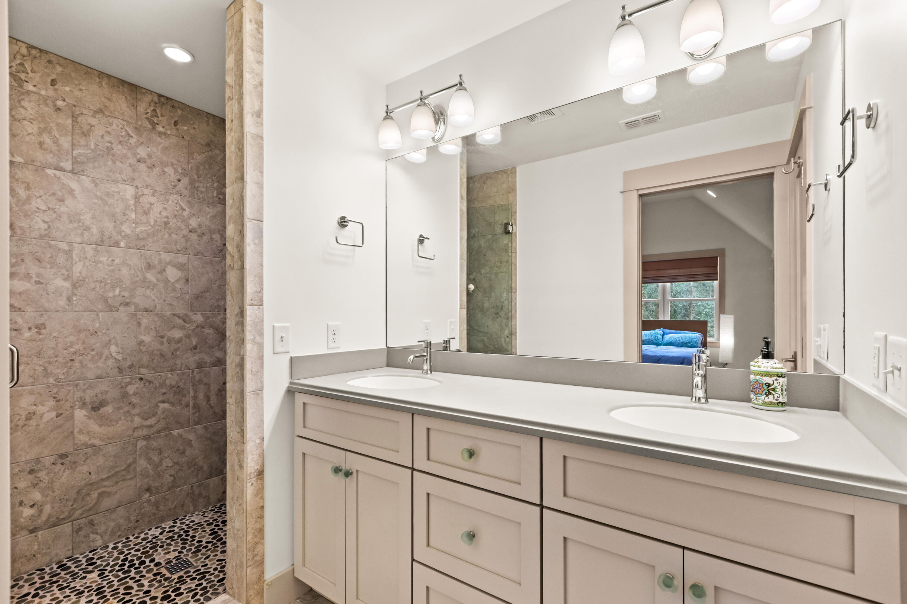 321 Seabreeze Boulevard Seacrest, FL 32461 - Photo 41 of 51 a bathroom with a sink and a mirror