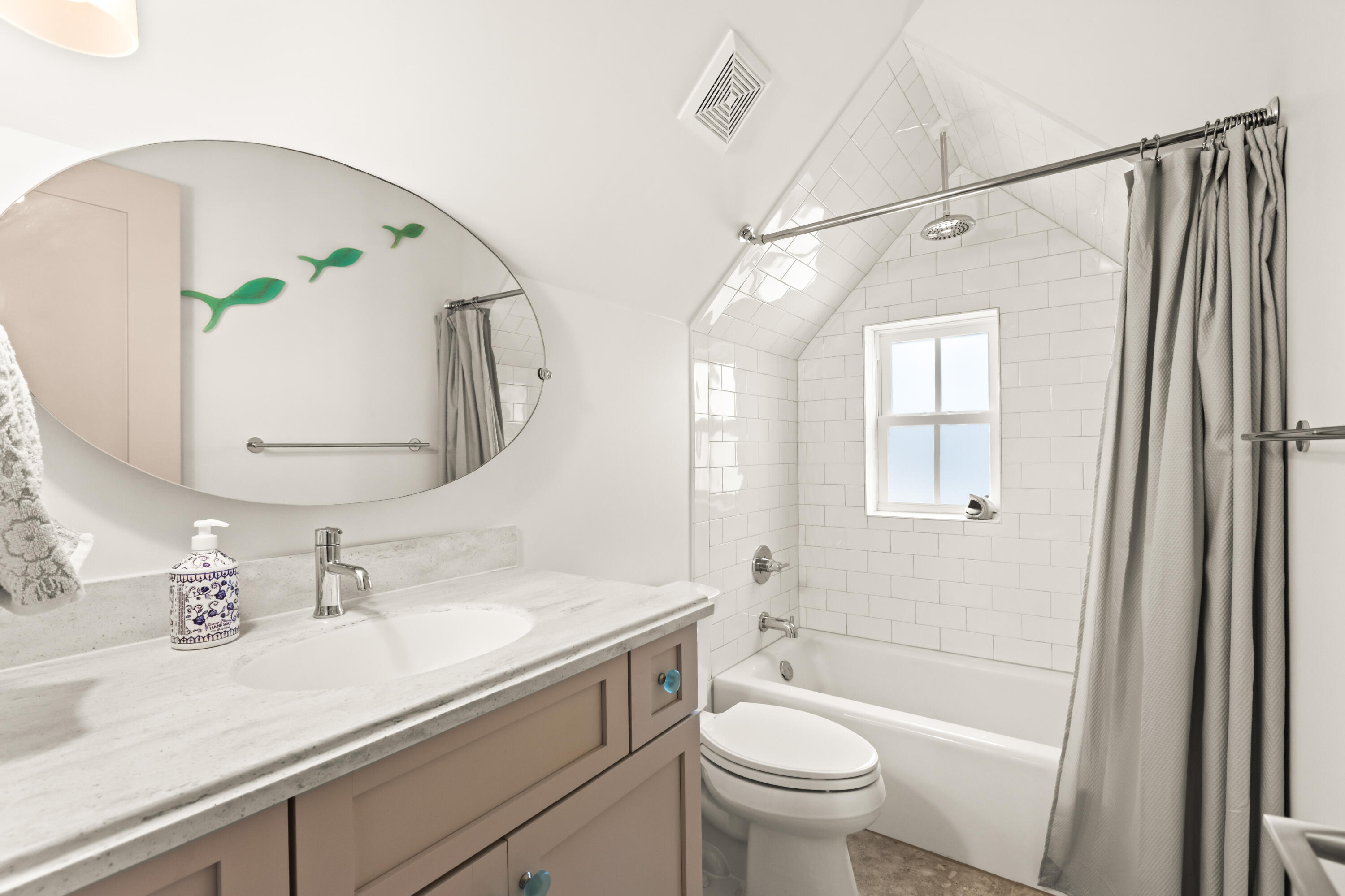 321 Seabreeze Boulevard Seacrest, FL 32461 - Photo 44 of 51 a bathroom with a sink a toilet and a mirror