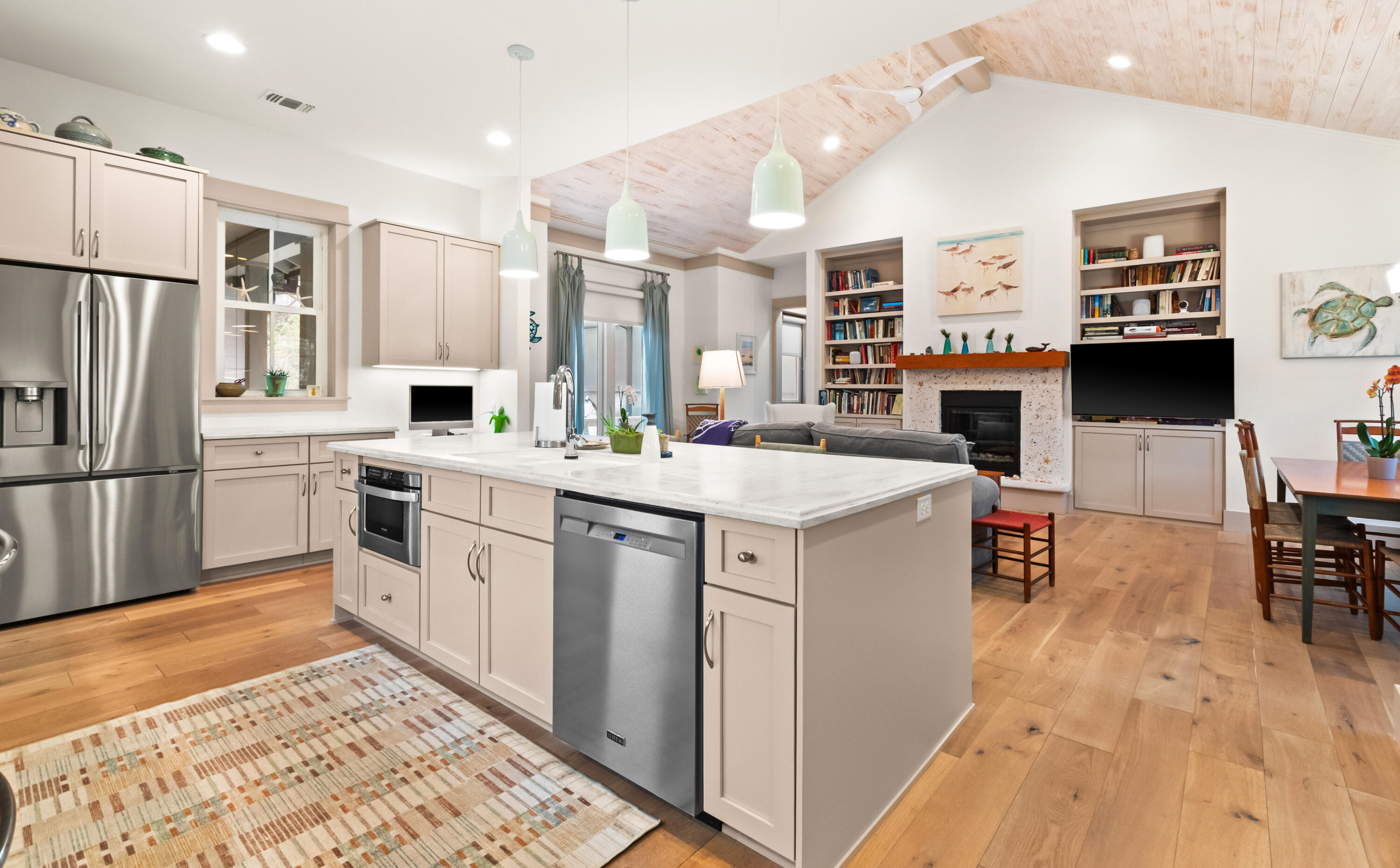 321 Seabreeze Boulevard Seacrest, FL 32461 - Photo 7 of 51 a kitchen that has a lot of white cabinets a sink and appliances