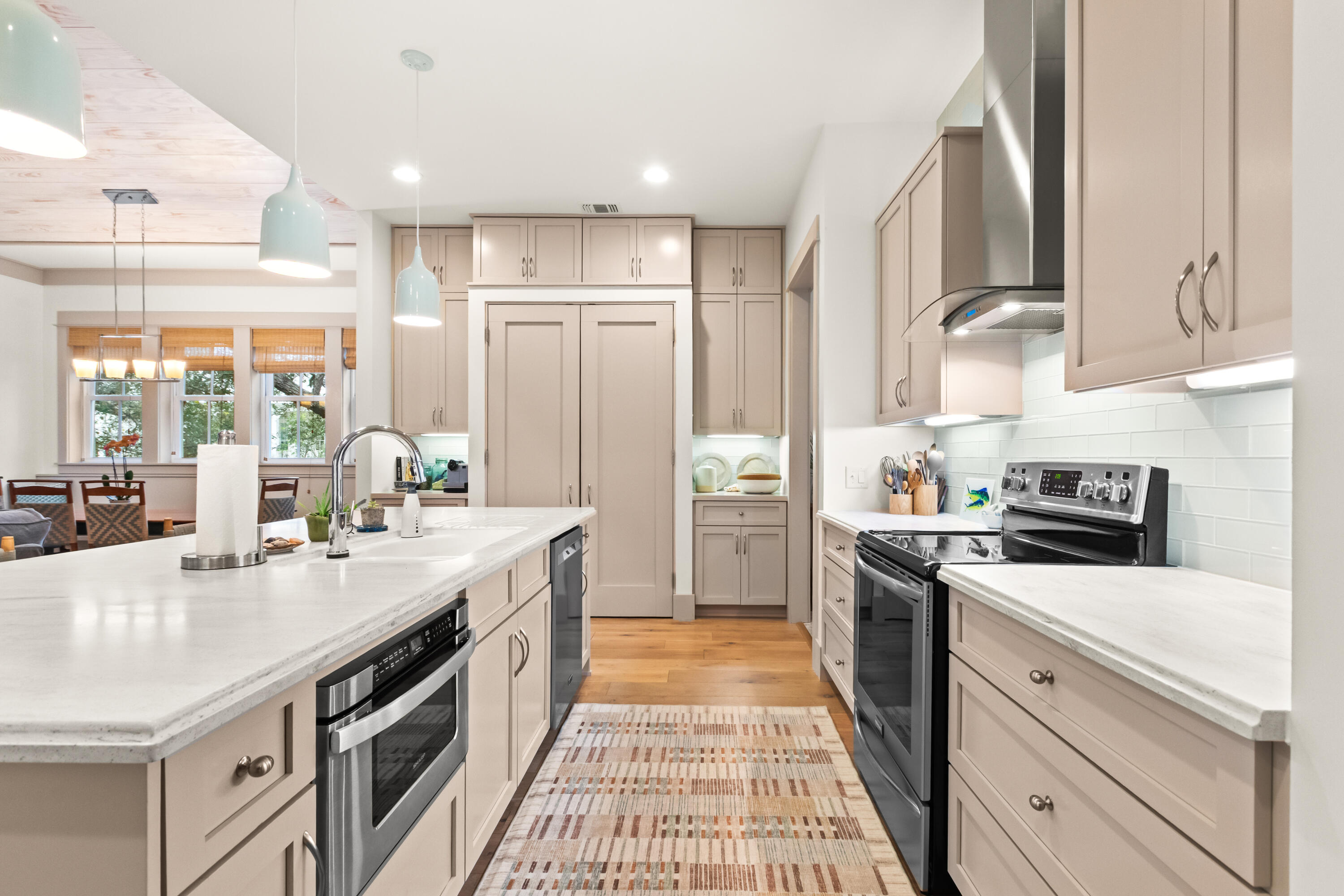 321 Seabreeze Boulevard Seacrest, FL 32461 - Photo 9 of 51 a kitchen with a sink stove and refrigerator