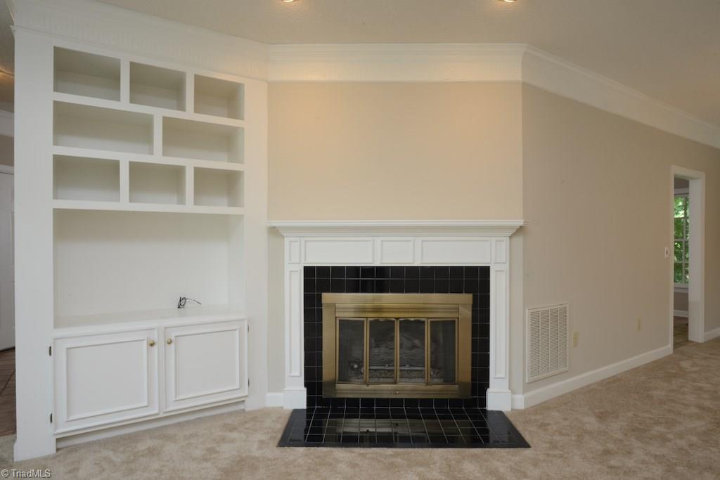 918 Flicker Lane High Point, NC 27262 - Photo 5 of 27 Fireplace and built in bookshelves in this great room