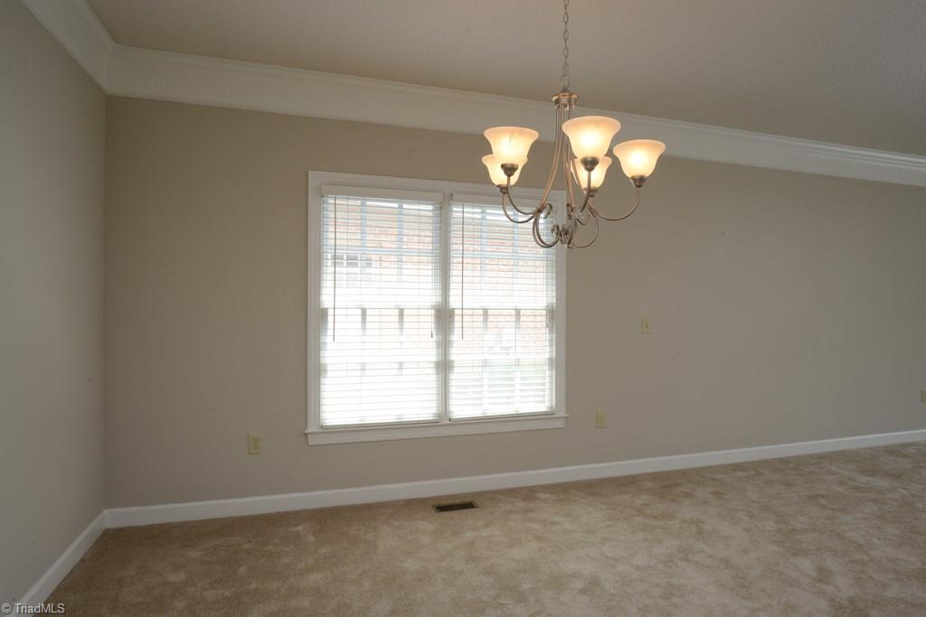 918 Flicker Lane High Point, NC 27262 - Photo 9 of 27 Dining room opens onto kitchen and has great light