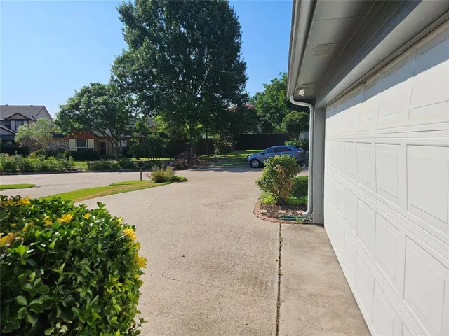 a view of a swimming pool with a yard