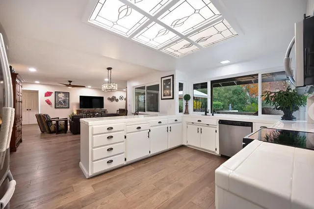 a view of a deck with wooden floor and outdoor seating