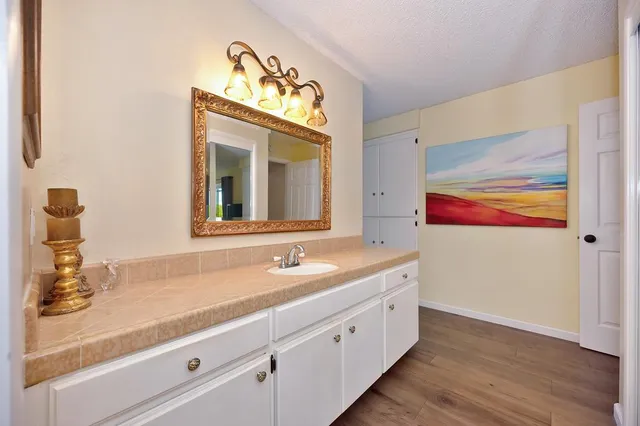 a front view of a house with a yard table and chairs