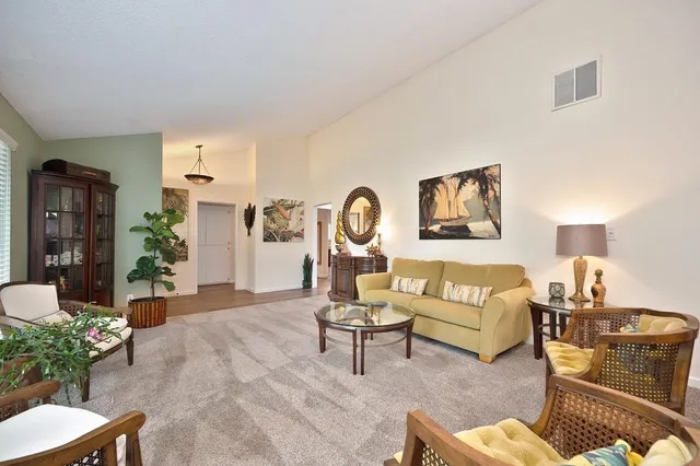 a dining room with furniture and window