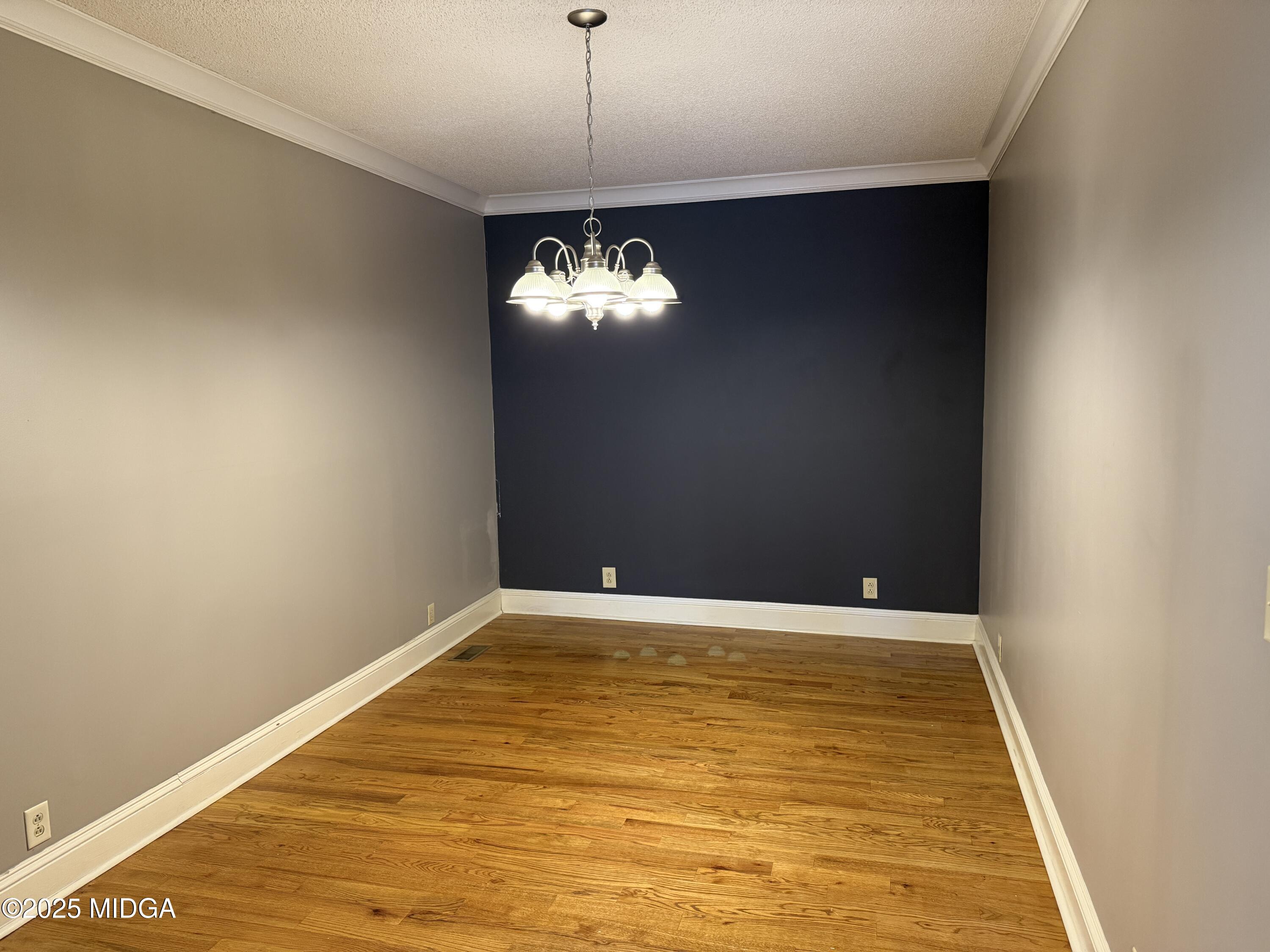 175 Corbin Avenue, Unit A Macon, GA 31204 - Photo 11 of 15 a view of a room with a chandelier fan