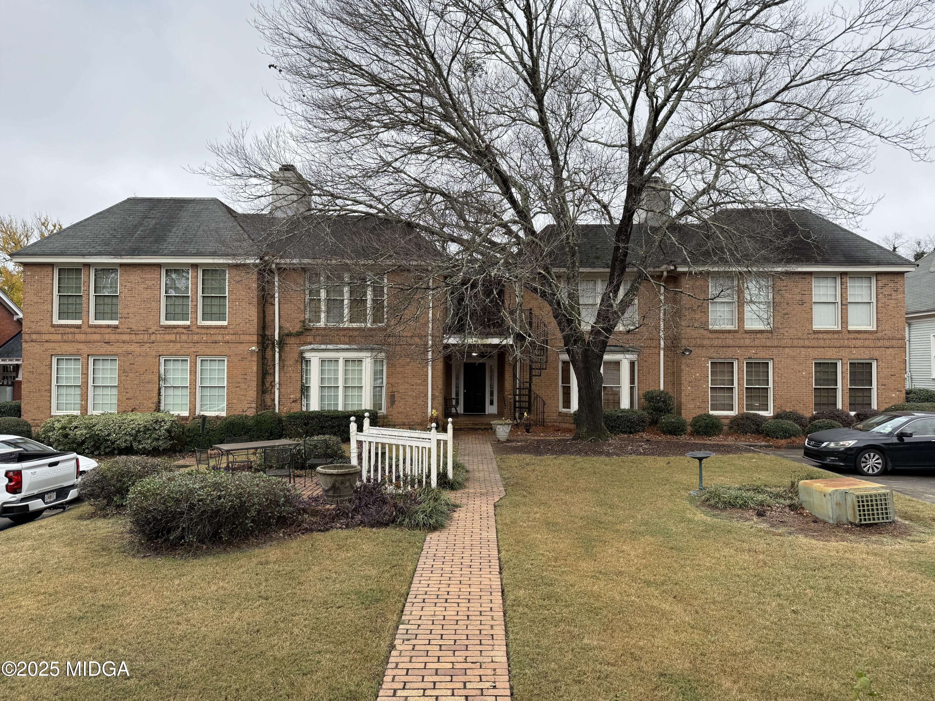 175 Corbin Avenue, Unit A Macon, GA 31204 - Photo 14 of 15 a front view of a building with trees in the background