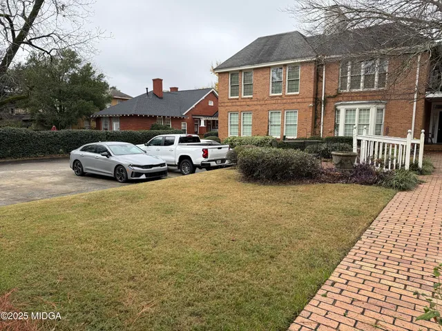 a view of street with parked cars