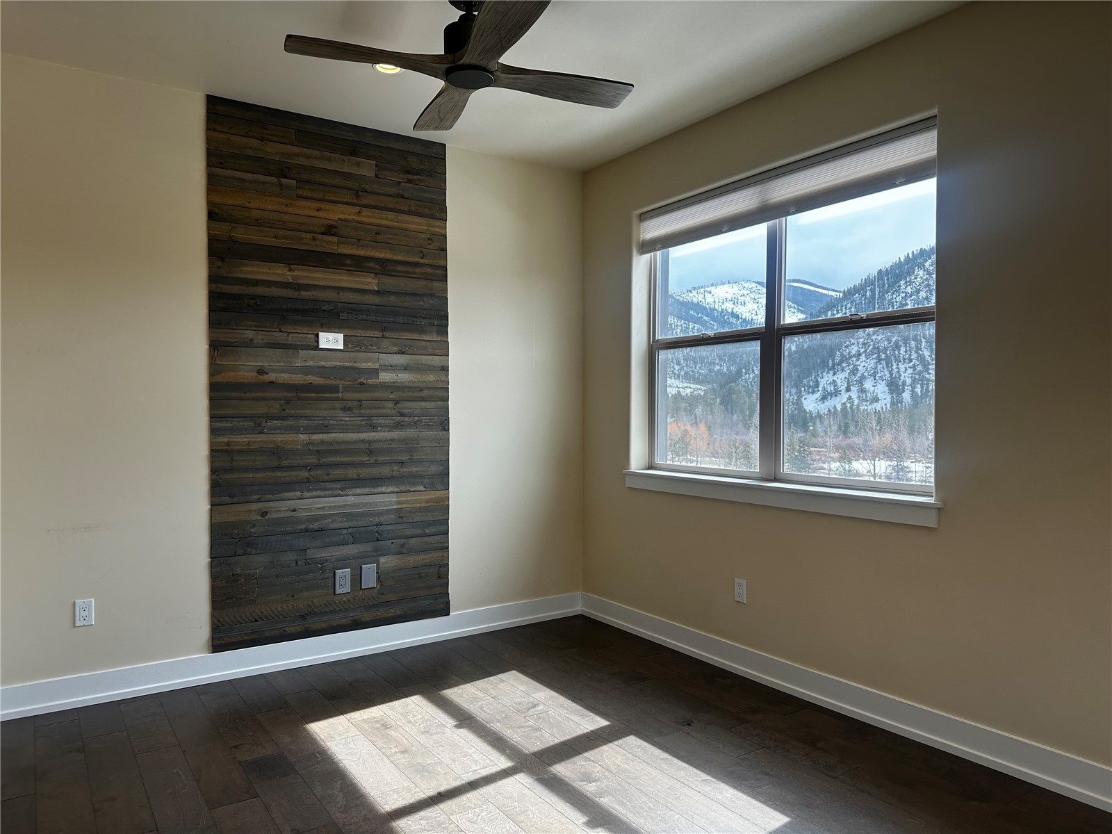 141 Wayback Drive, Unit B Keystone, CO 80435 - Photo 8 of 16 a view of an empty room with a window and wooden floor