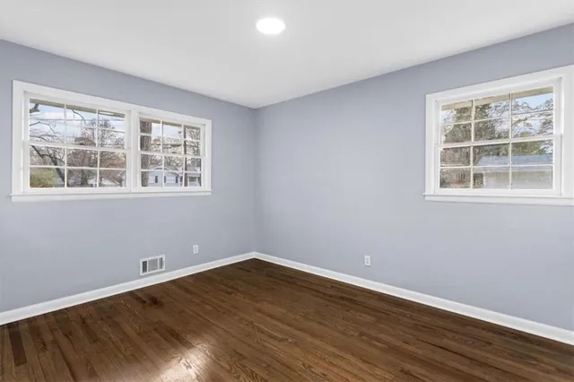 a bathroom with a shower toilet sink and mirror