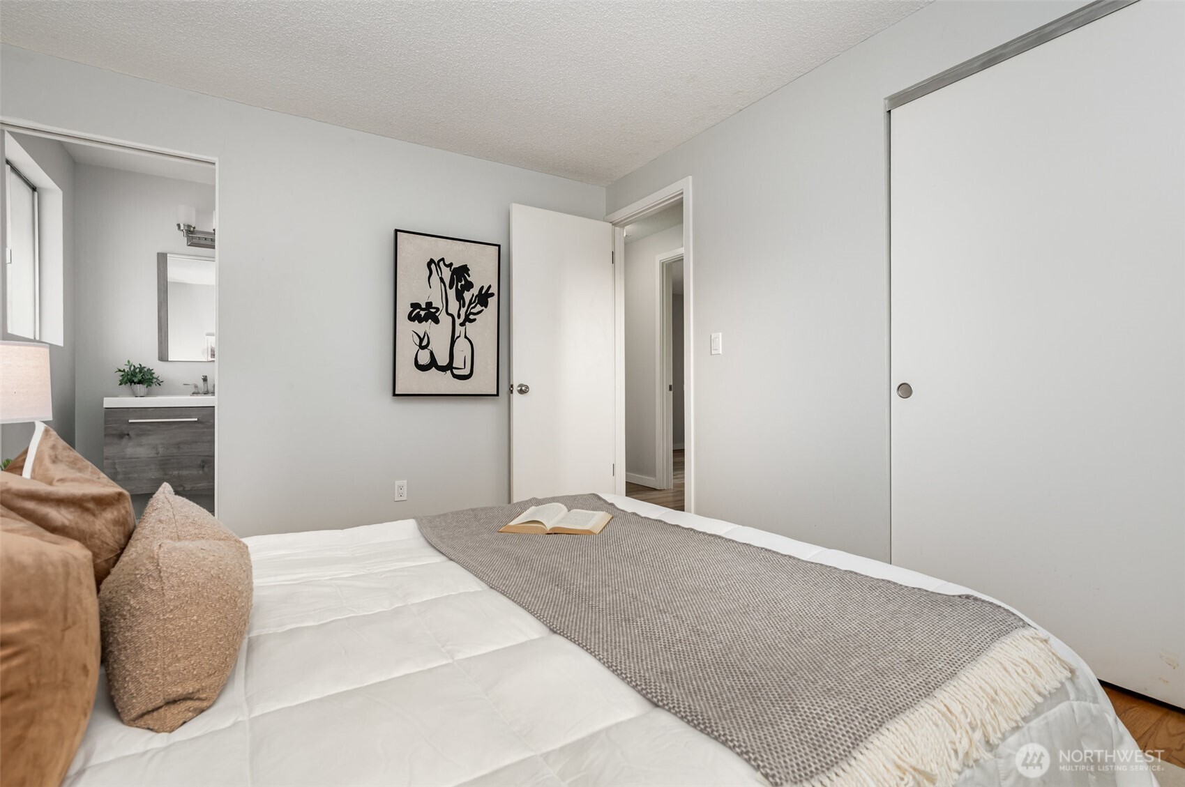 11804 Southeast 165th Street Renton, WA 98058 - Photo 12 of 28 a bedroom with a large bed and a couch