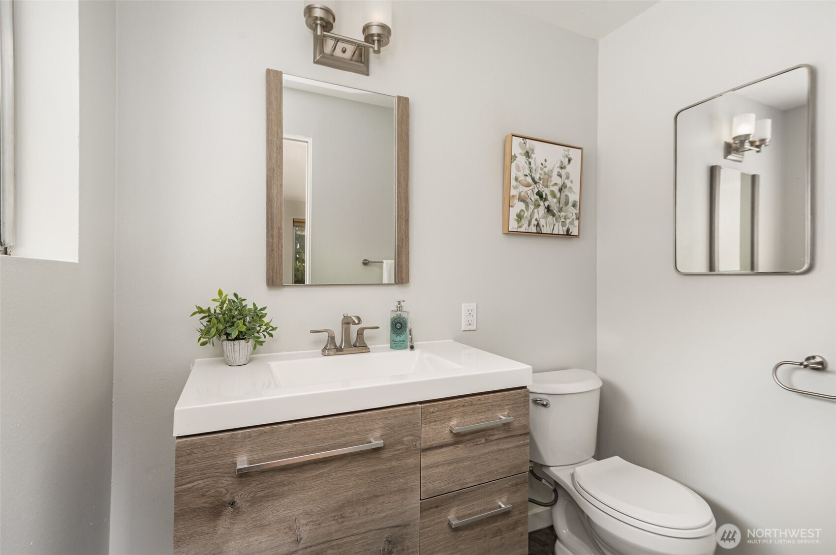 11804 Southeast 165th Street Renton, WA 98058 - Photo 14 of 28 a bathroom with a sink vanity mirror and toilet
