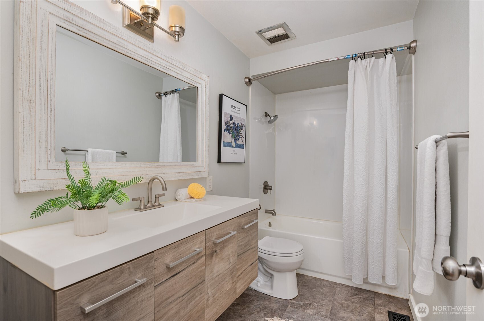 11804 Southeast 165th Street Renton, WA 98058 - Photo 15 of 28 a bathroom with a sink a toilet and shower