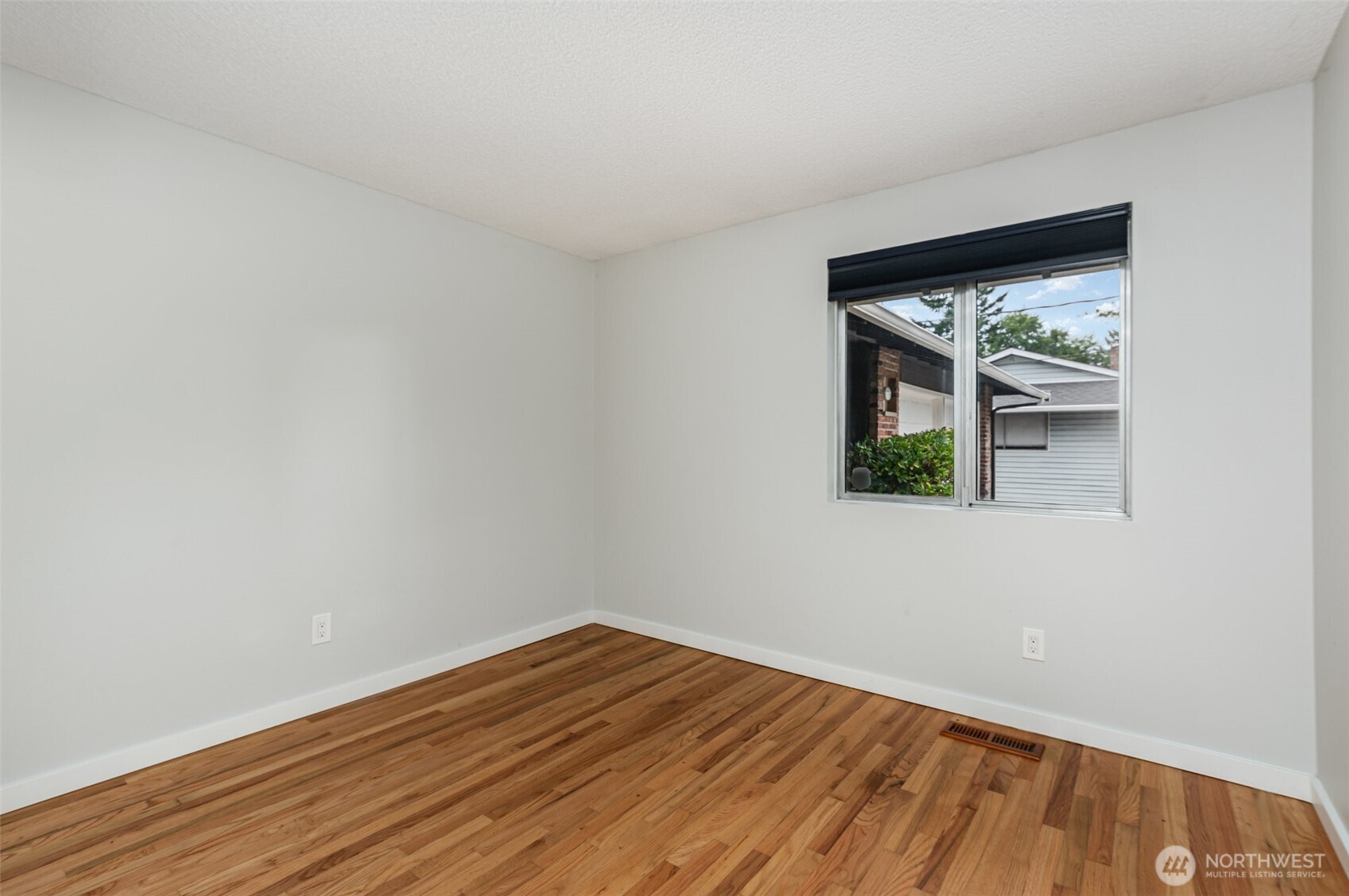 11804 Southeast 165th Street Renton, WA 98058 - Photo 17 of 28 a view of wooden floor in a room