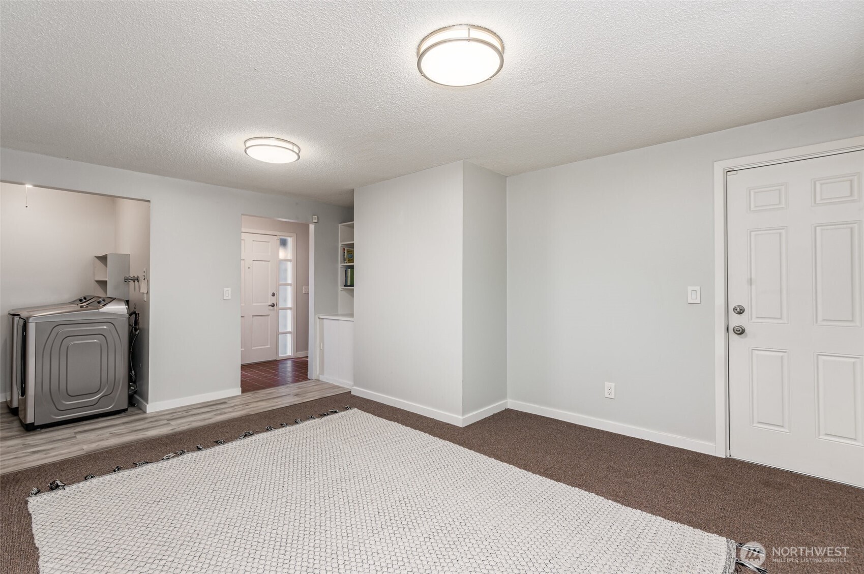 11804 Southeast 165th Street Renton, WA 98058 - Photo 19 of 28 a bedroom with a bed and a view of bathroom