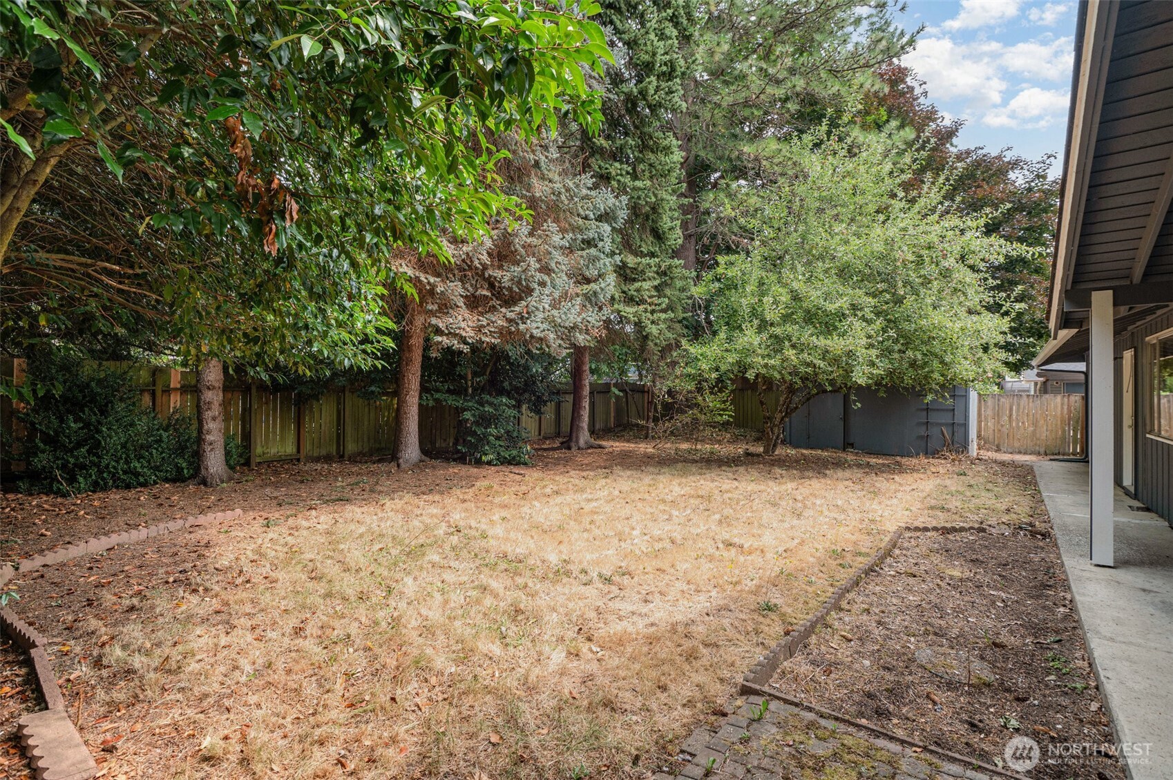 11804 Southeast 165th Street Renton, WA 98058 - Photo 22 of 28 a backyard of a house with lots of green space