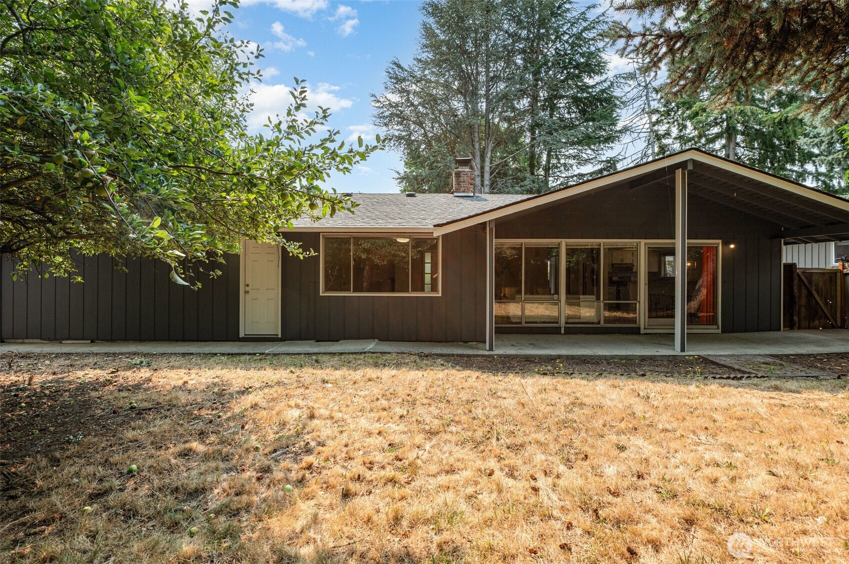 11804 Southeast 165th Street Renton, WA 98058 - Photo 23 of 28 a house with trees in the background